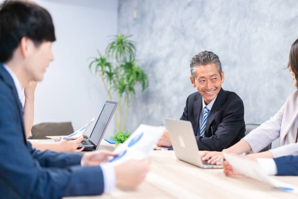 istock Businesspeople having a discussion in the office 1358562672