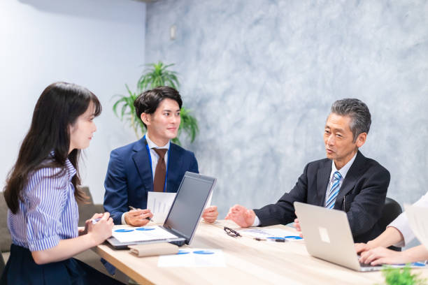 istock Businesspeople having a discussion in the office 1358562702