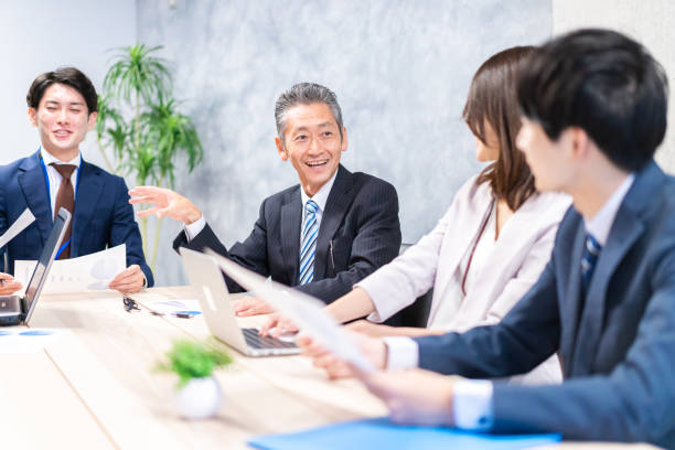 istock Businesspeople having a discussion in the office 1358562710