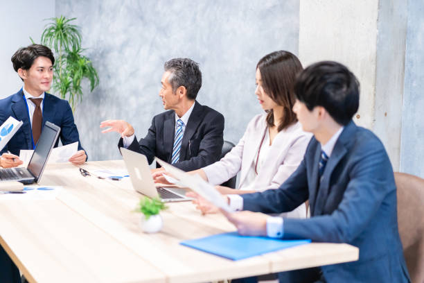 istock Businesspeople having a discussion in the office 1358562712