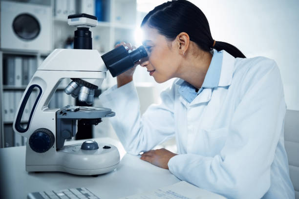 istock Shot of a young scientist using a microscope in a laboratory 1358566613