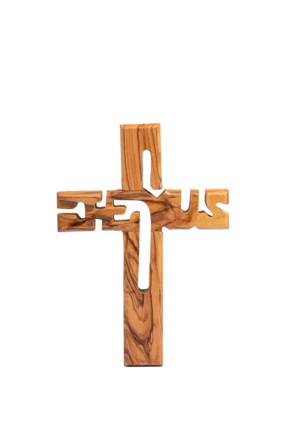 istock Wooden crucifix standing on white background. 1358566731