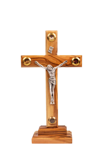 istock Wooden crucifix standing on white background. 1358566801