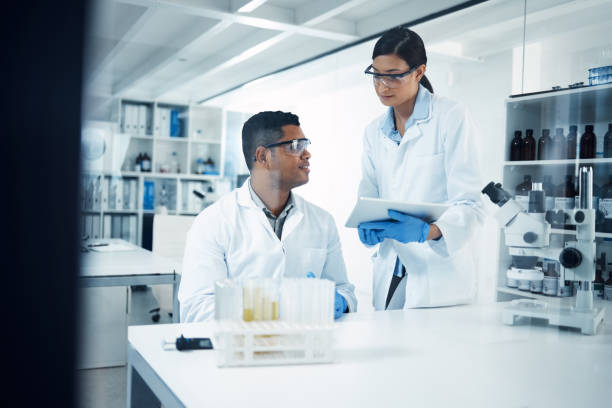 istock Shot of two young scientists using a digital tablet while conducting medical research in a laboratory 1358567723