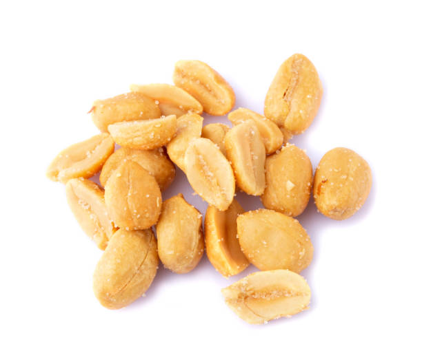 istock Roasted salted peanuts isolated on a white background 1358570645