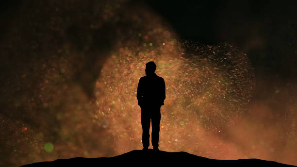 istock The man standing on a flying particles background 1358570659