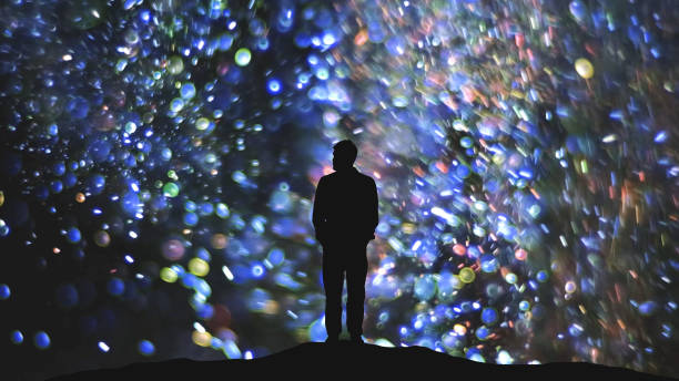 istock The man standing on a flying particles background 1358570664