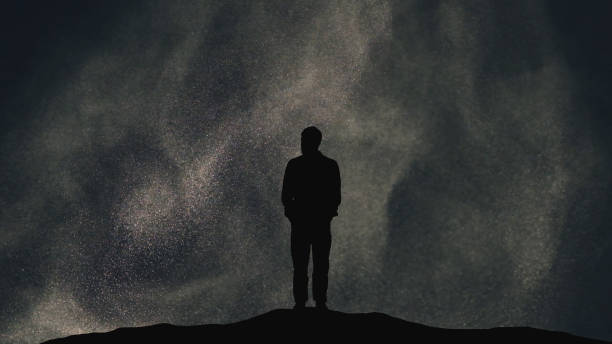 istock The man stands on a flying cosmic particles background 1358570666