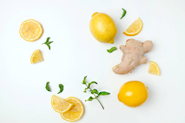 istock Fresh ginger and lemon on white background. Flat lay, top view, copy space. Seasoning, spice, ingredient for tea 1358573823