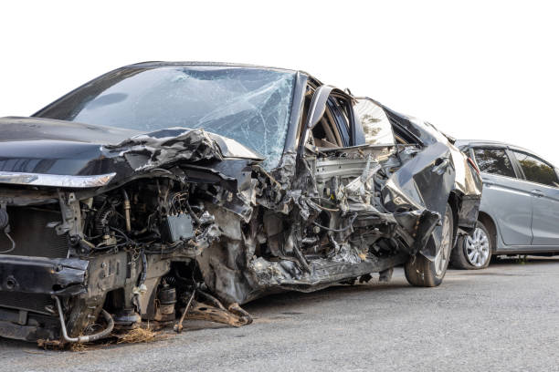 istock Low side view of a sedan that was smashed in a fatal collision. 1358574785