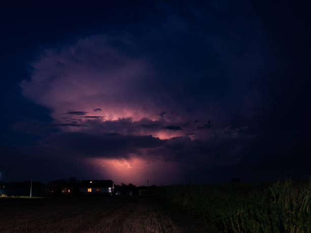 istock Thundercloud over the Romanian landscape is illuminated by pink lightning 1358576236