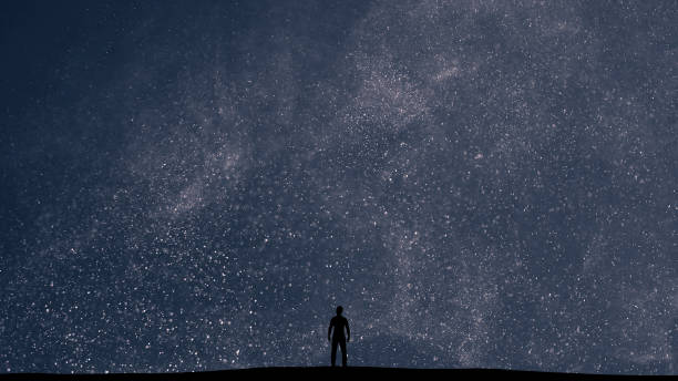 istock The man stands on a picturesque starry sky background 1358577104