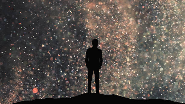 istock The human silhouette standing on a starry sky background 1358577173