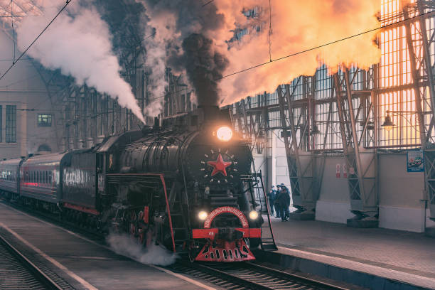 retro steam train departs from the station at morning time. - 7595 imagens e fotografias de stock