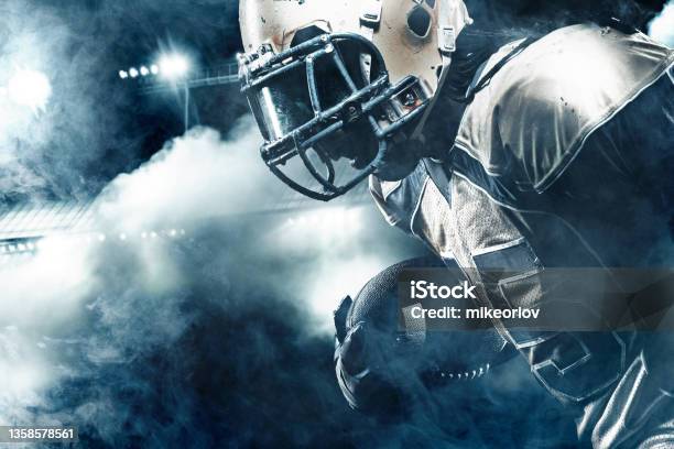 American Football Sportsman Player On Stadium Running In Action Stock Photo - Download Image Now