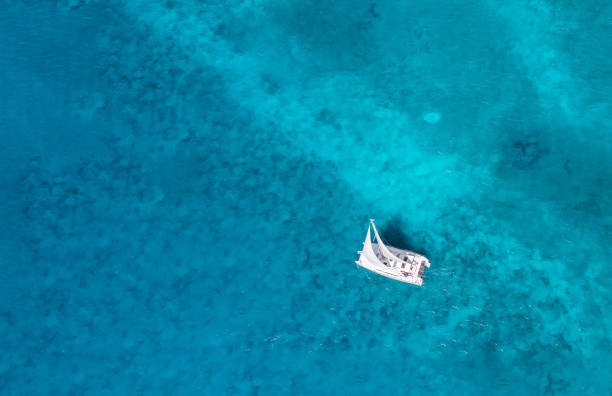 istock Sailing over blue ocean with aqua colors 1358581257