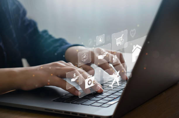 istock Businessman working with modern computers showing innovative virtual insurance online for auto, travel, family and life insurance icons. Finance and health. insurance concept 1358583968
