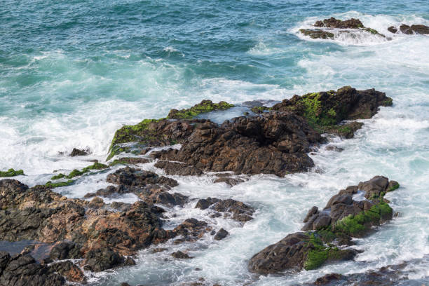istock Ocean waves breaking on the rocks on the beach. 1358585153