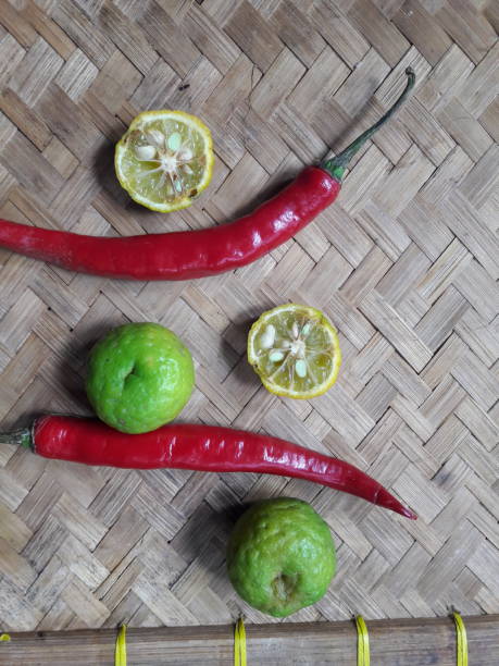 istock Red chili and lime put on the table 1358585378
