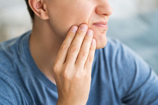 istock A man with toothache, periodontal disease in wisdom teeth 1358585412