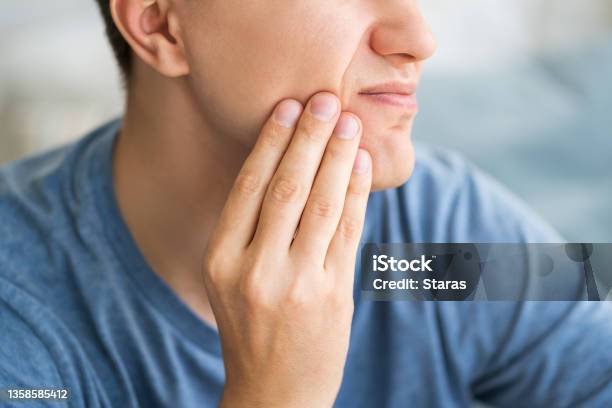 A Man With Toothache Periodontal Disease In Wisdom Teeth Stock Photo - Download Image Now