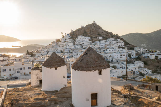 istock Ios and the windmills at sunset 1358585584