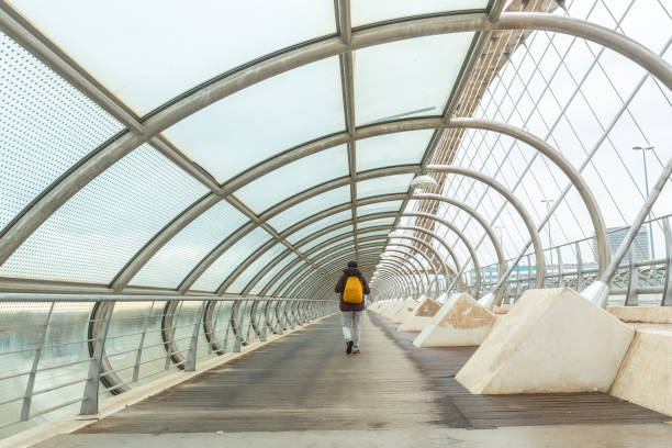 istock Man on The Third Millennium Bridge in Zaragoza, Spain 1358586464