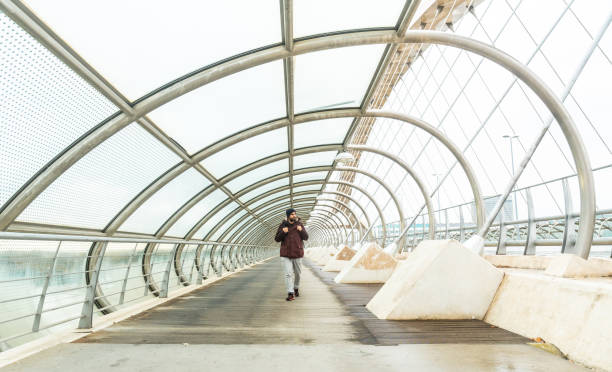 istock Man on The Third Millennium Bridge in Zaragoza, Spain 1358586488