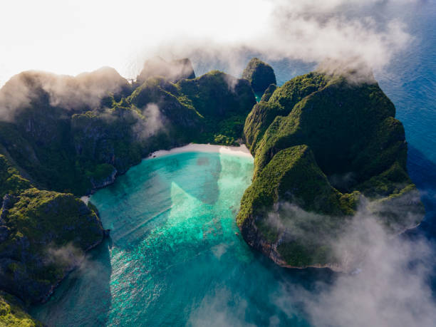 Maya Bay Koh Phi Phi Thailand, Drone aerial view of Maya Bay Koh Phi Phi Thailand Maya Bay Koh Phi Phi Thailand, Drone aerial view of Maya Bay Koh Phi Phi Thailand on a beautiful summer day marine reserve photos stock pictures, royalty-free photos & images