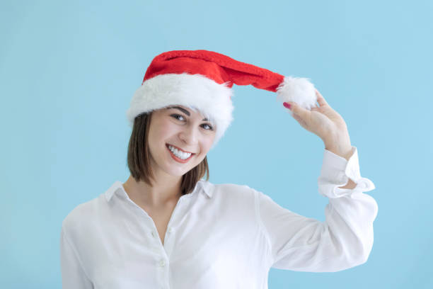 Beautiful woman playing with Santa hat
