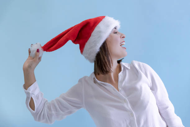 Beautiful woman playing with Santa hat