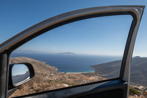 View from car window frame of beautiful beach and coastline