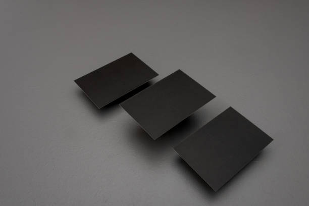 istock three Black mock up business card for branding on grey rustic background . 1358600059