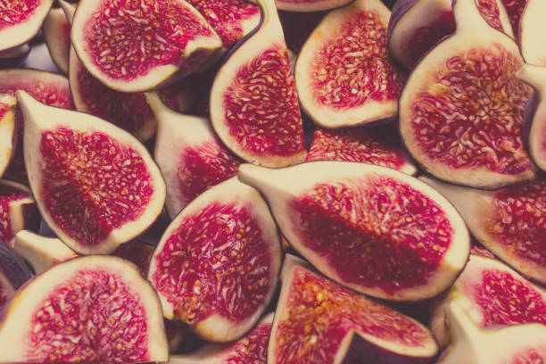 istock Tasty figs background. Top view. 1358602545