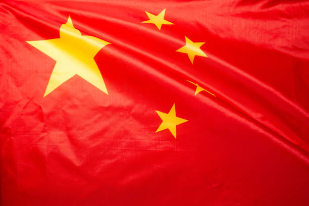 istock China flag waving as a background. 1358602603