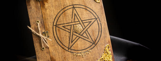 istock Old book of black magic. Concept for mystery, fantasy, evil 1358603793