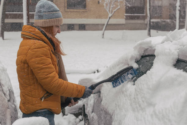 istock Cleaning snow off car 1358603965