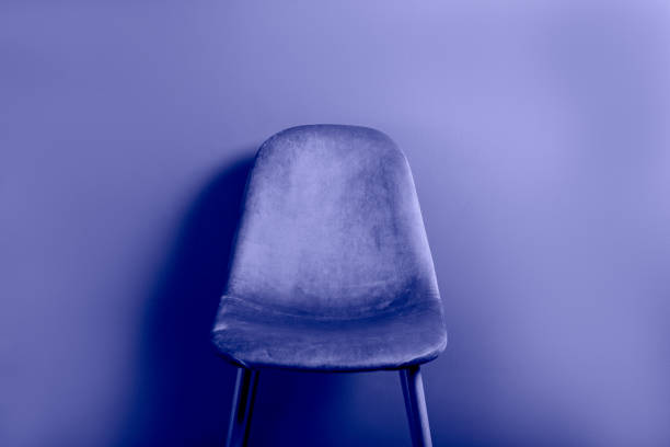 Modern Blue Velour Chair on wooden legs stock photo