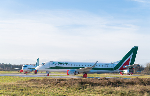 ENSCHEDE, NETHERLANDS - DECEMBER 10, 2021: Embraer 175 twin-engine jet airliners on Twente airport. Due to ceased operations on 15 October 2021 5 planes are stalled here until a new tenent is found.