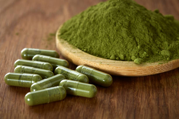 istock Capsules filled with Moringa powder 1358608676