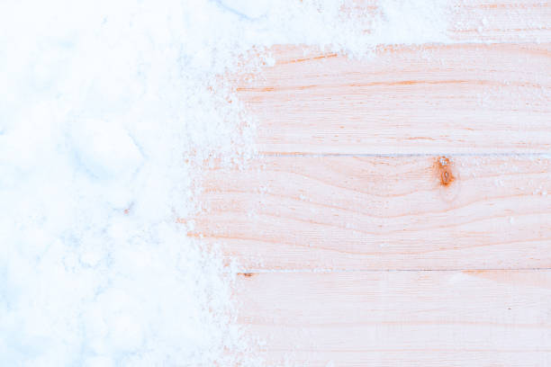 istock Table snow. Winter wooden texture background. Christmas board with old rustic wood wall, white frozen ice. Merry Christmas holiday card pattern. 1358610140