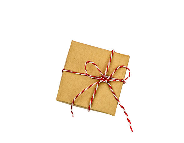 istock Box tied with red rope, a gift isolated on a white background. 1358610658
