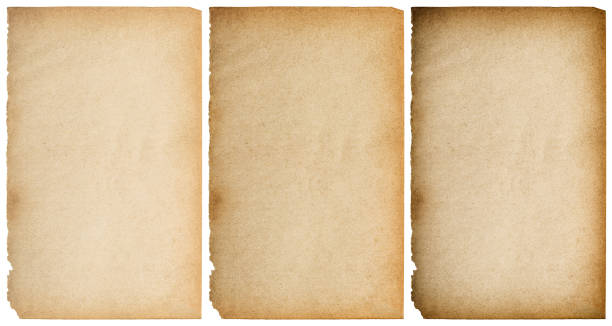 istock Old grungy paper texture background ripped edges isolated 1358610687