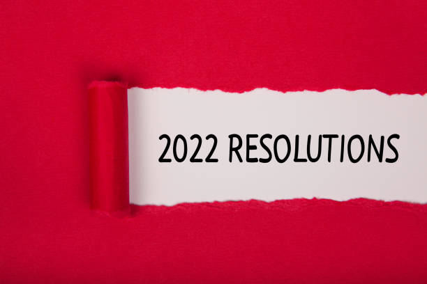 istock Torn Paper With New Year 2022 Resolutions On White Background 1358611281