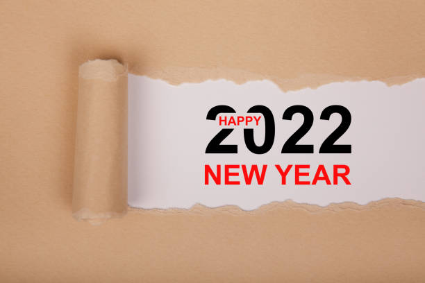 istock Torn Paper With Happy New Year 2022 On White Background 1358611290