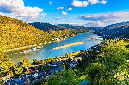Rhine Castles: Journey into the German Middle Ages. The hills are home to the well groomed vineyards. Romantic castles on the banks of the Rhine. Sunset