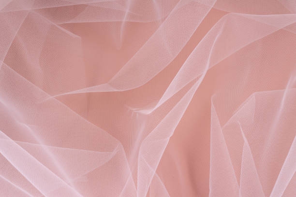 istock Nylon transparent fabric on a beige background. Selective focus. 1358611723
