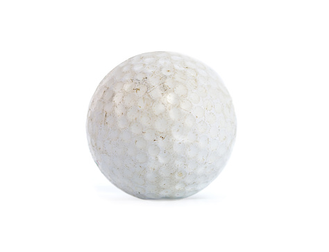 Old used golf ball isolated on white