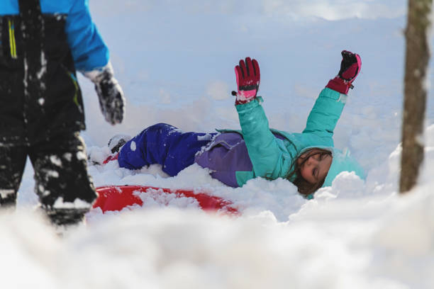 istock Brother & Sister Sledding 1358612756