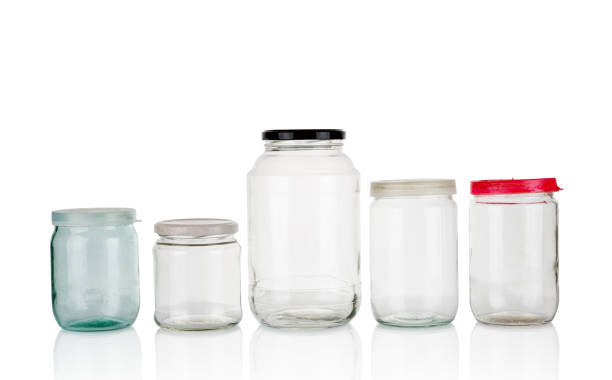 istock Few empty glass jars isolated on white background 1358613084